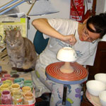 Painting a bowl at Rampini Ceramics